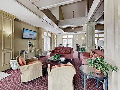 a living room with couches and chairs and a table at DisneyResortVillas by AmericanVacationLiving 1 BR in Orlando