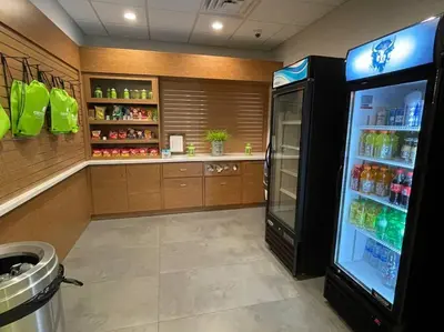 a kitchen with a refrigerator with drinks in it at Newly renovated room in cozy hotel near Disney 2 in Kissimmee