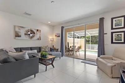 a living room with a couch and a table at Priceless Peace at Serenity by Shine Villas, 081 townhouse in Orlando