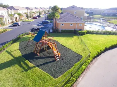 a playground with a slide in the grass at Priceless Peace at Serenity by Shine Villas, 081 townhouse in Orlando