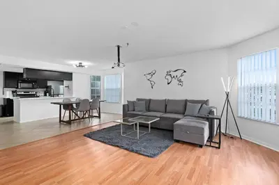 a living room with a couch and a table at DONOT BOOK thakn you in Kissimmee