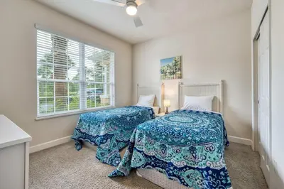 a bedroom with two beds and a window at Distinctive Home Private Pool in Orlando