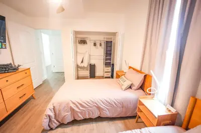 a bedroom with a bed and a dresser and a mirror at ORLANDO - BLUE HERON Great Apt - 7 pax in Orlando