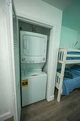 a small room with a tv and a bunk bed at ORLANDO - BLUE HERON Great Apt - 7 pax in Orlando