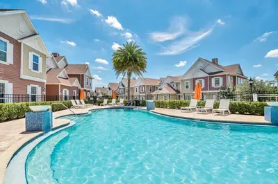 a swimming pool in a villa with a house at NEW awesome dream house, 5 Min to Disney in Orlando