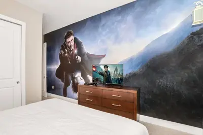 a bedroom with a large painting on the wall at New Awesome decorated dreamhouse in Orlando