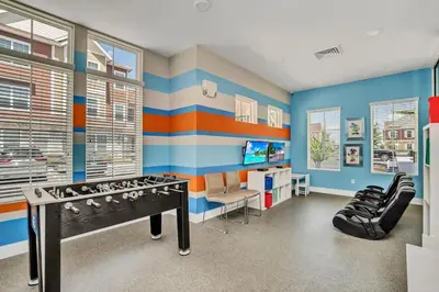 a boys room with a bed and a desk at New Awesome decorated dreamhouse in Orlando