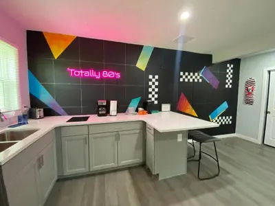 a kitchen with a sink and a counter top at Totally 80s! in Sanford
