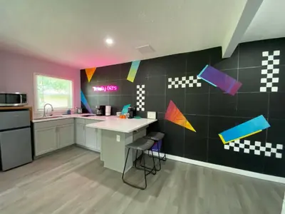 a kitchen with a sink and a counter top at Totally 80s! in Sanford