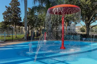 a fountain in the middle of a pool at Mickey's Whimsical Wonderland in Kissimmee