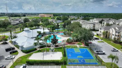 an aerial view of a park with a tennis court at Mickey's Whimsical Wonderland in Kissimmee