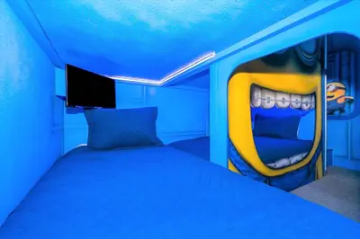 a room with a bed with a large mouth on it at EPIC Disney 10Min Retreat, 8BR Resort Villa and Arcade in Orlando