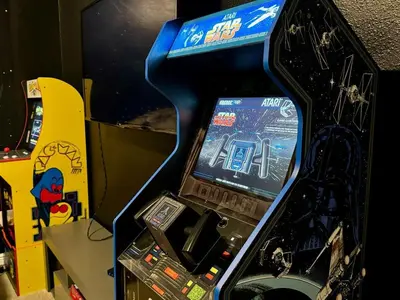 a video game arcade machine with a video gameigun at 411-IBRHAIM · 411 Sparkling Spotless Villa in Encore in Orlando