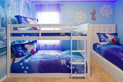 two bunk beds in a blue room with snowman decorations at Great 6bedrooms home in Kissimmee w Private Pool 8426 in Kissimmee