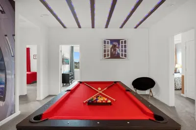 a pool table in a room with a red pool at Super Deal - Brand New Themed 9BR Home near Disney in Kissimmee
