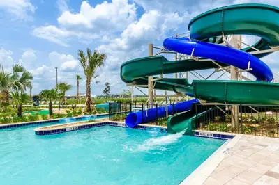a water slide in a pool at a resort at Family Fun with Mickey and Frozen at Storey Lake in Kissimmee