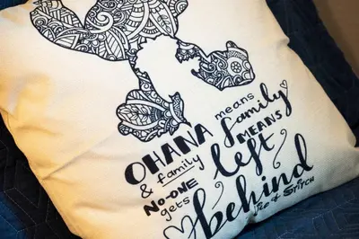 a pillow with a drawing of a dolphin on it at Storey Lake Townhome fun for families at Remy's Retreat in Kissimmee