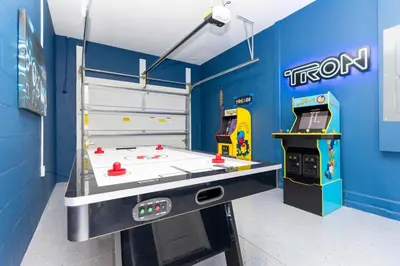 a room with a ping pong table in a room at Super Luxury Modern Home, Prime Location in Kissimmee