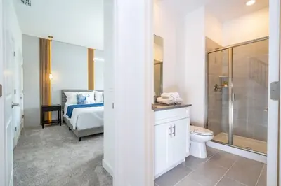 a bathroom with a bed and a toilet and a shower at WonderFul 4Bd w Pool Close to Disney at StoreyLake 2669 in Kissimmee