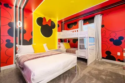 a bedroom with two bunk beds and red and yellow walls at WonderFul 4Bd w Pool Close to Disney at StoreyLake 2669 in Kissimmee