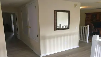 a hallway with a mirror on a wall at Emerald Island Diamond on the Island in Kissimmee