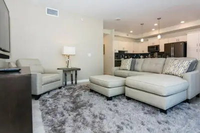 a living room with two couches and a rug at Premium Apartment 2BR2BA • Near Disney • PoolLazy River at Storey Lake Resort SL47316 in Kissimmee