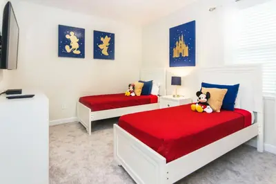 a bedroom with two beds with red sheets at Delux Apartment 4BR3BA • Near Disney • PoolLazy River at Storey Lake Resort SL47412 in Kissimmee