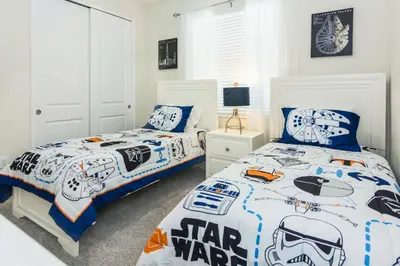 two beds in a bedroom with a star wars bedroom at Delux Apartment 4BR3BA • Near Disney • PoolLazy River at Storey Lake Resort SL47412 in Kissimmee