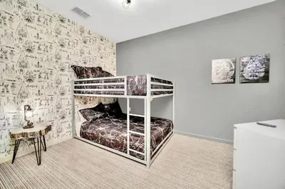 a bedroom with a bunk bed in a room at 3BR Condo - Near Disney Balcony Pool in Orlando