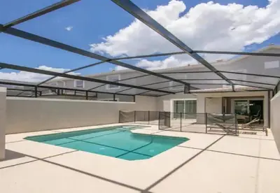 a swimming pool on the roof of a house at Stunning Townhouses 5 Minutes away Disney! in Kissimmee
