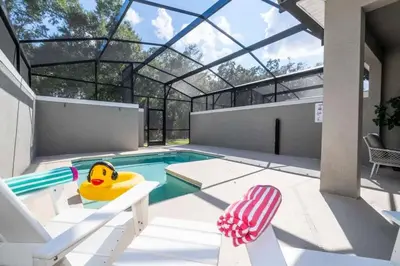 a swimming pool with a rubber duck in a house at Gorgeous 4 Bd w Pool at Storey Lake Resort 2485 in Kissimmee