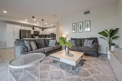 a living room with a couch and a table at Superb Spacious Condo Prime Resort in Kissimmee