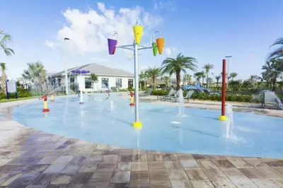 a playground with water fountains in a park at Modern Apartment 2BR2BA • Near Disney • Storey Lake Resort SL47314 in Kissimmee