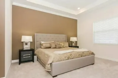 a bedroom with a bed with two night stands and two lamps at Splendid Apartment 4BR3BA • Near Disney • PoolLazy River at Storey Lake Resort SL47512 in Kissimmee