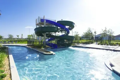 a water slide in a pool at a resort at Splendid Apartment 4BR3BA • Near Disney • PoolLazy River at Storey Lake Resort SL47512 in Kissimmee