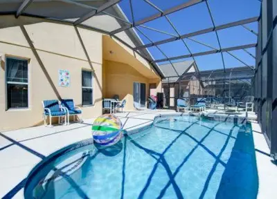 a large swimming pool with a large glass ceiling at Emerald Island Kissimmee in Kissimmee