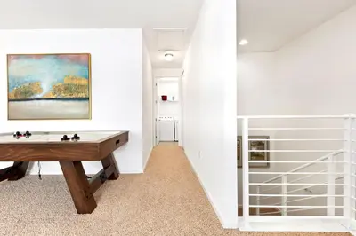 a room with a desk and a painting on the wall at Family-Friendly Mansion at Sonoma Luxury Resort in Kissimmee