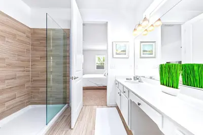 a bathroom with a shower and a sink and a tub at Family-Friendly Mansion at Sonoma Luxury Resort in Kissimmee