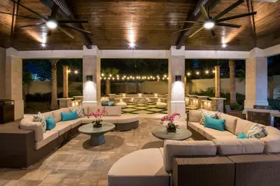 a large lobby with couches and tables and lights at Family-Friendly Mansion at Sonoma Luxury Resort in Kissimmee