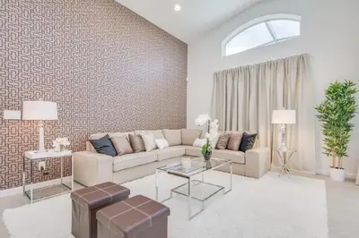 a living room with a couch and a table at Premium Comfort - Beautiful Home Private Pool in Kissimmee