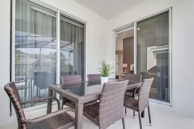 a dining room with a table and chairs at Premium Comfort - Beautiful Home Private Pool in Kissimmee