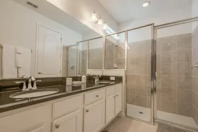 a large bathroom with a sink and a shower at Premium Comfort - Beautiful Home Private Pool in Kissimmee