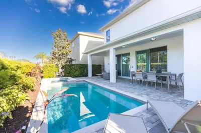 a swimming pool in the backyard of a house at Comfy Modern House w Pool Perfect Location in Orlando