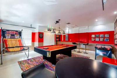 a room with a pool table and a ping pong ball at 4br House w Perfect Location Pool and Much More in Kissimmee