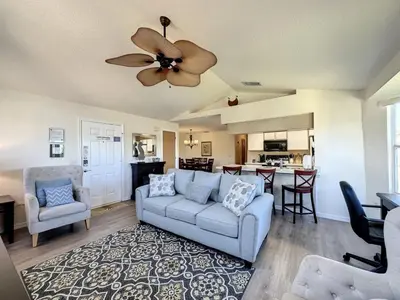 a living room with a couch and a ceiling fan at Lovely 3 bed Condo Near Disney Quiet Community condo in Kissimmee