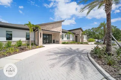 a house with a palm tree in front of it at NEW! House in Resort Waterpark Disney Orlando 2693 in Kissimmee