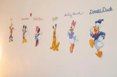 a group of cartoon characters on a wall at 545 -Beautiful 4 Bed Home with Sparkling Pool and Games Room in Orlando