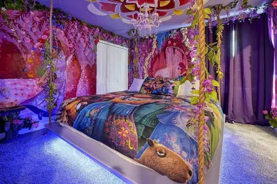 a bedroom with a bed in a room covered in flowers at NEW Themed 10B VillaPoolSpa in Kissimmee