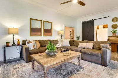 a living room with a couch and a coffee table at Fire Pit and Yard Updated Winter Garden Home! in Orlando