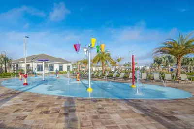 a playground with water fountains in a parking lot at Luxury Villa inside Storey Lake, Kissimmee - No Extra Fees in Kissimmee